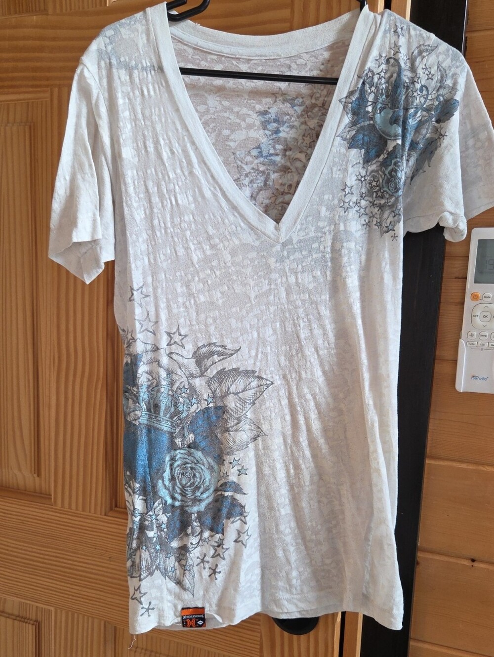 White V-Neck Short Sleeve Tee with Blue Floral Graphic